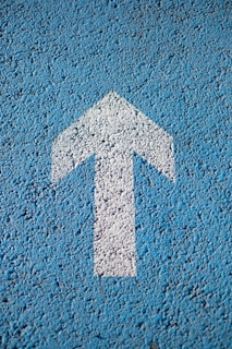 white arrow up