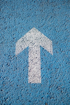 white arrow up