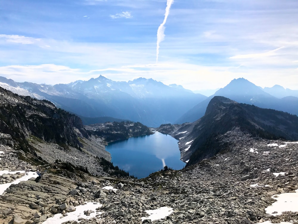 landscape photo of mountains near body of water during daytime