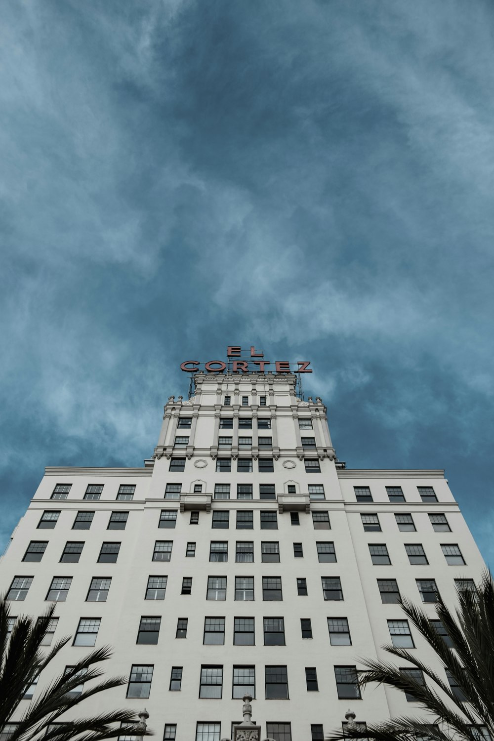 white high-rise building under blue sky