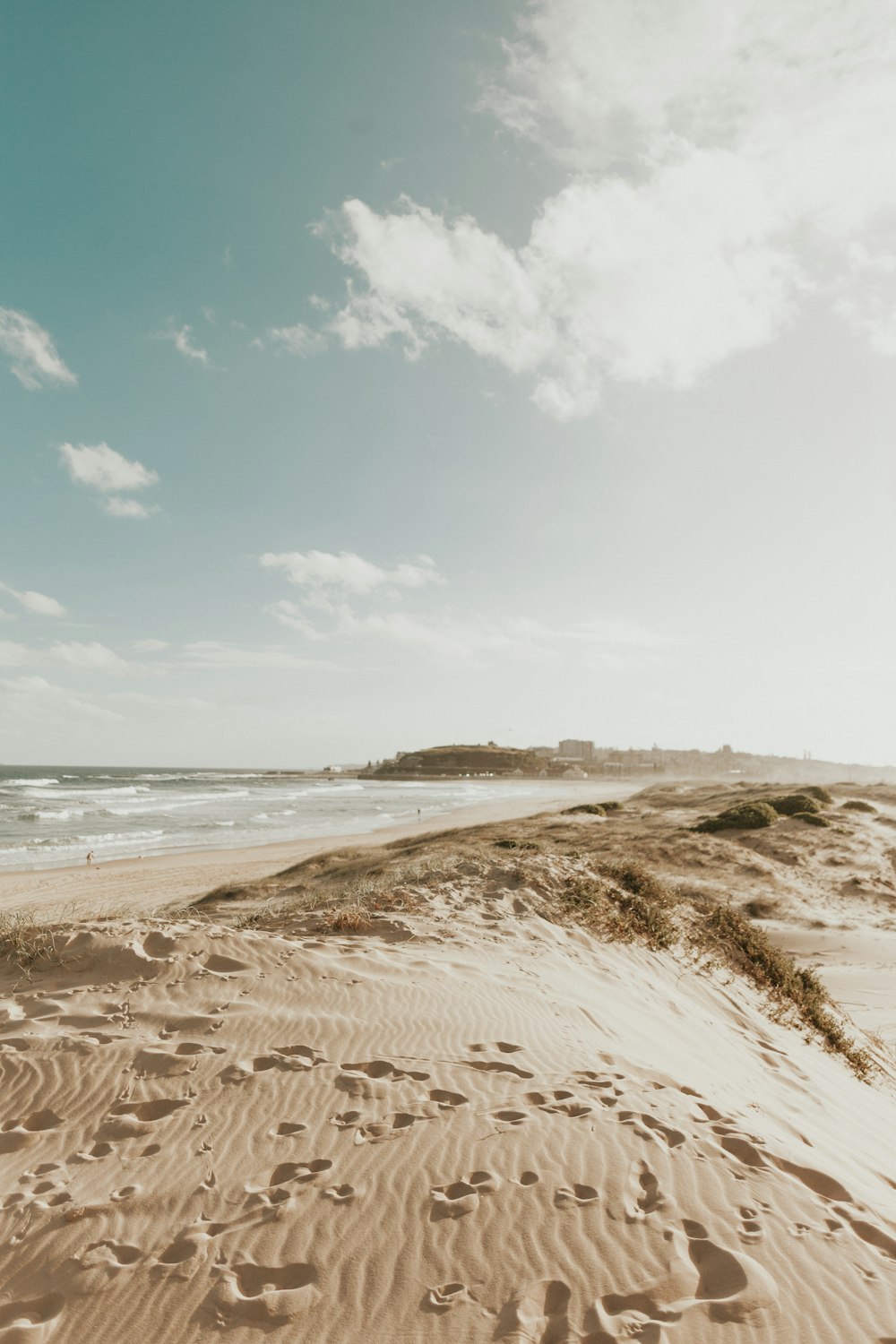 footprints in the sands near seashore