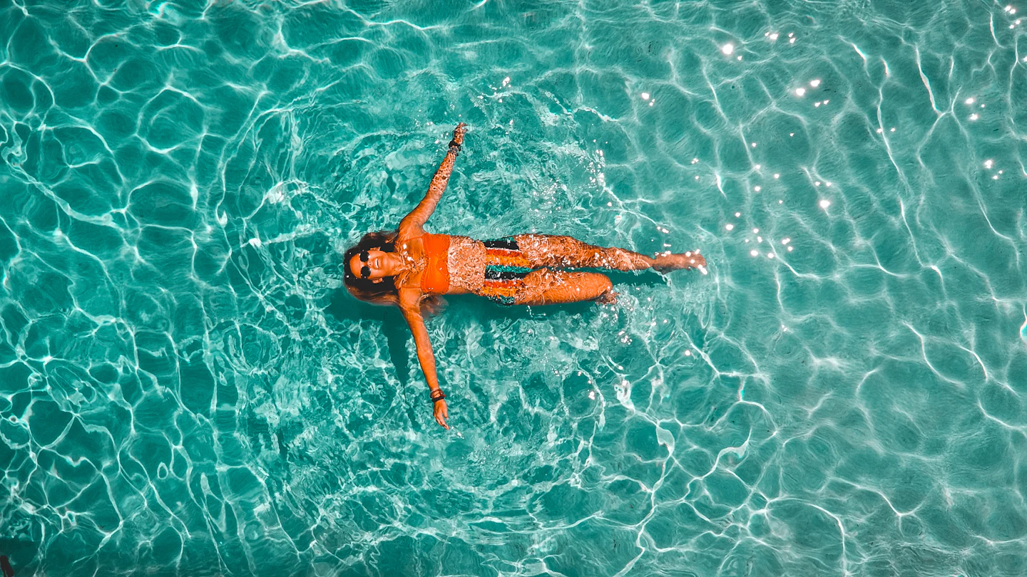 Swimming alone in clear blue water