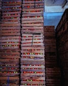 Stacks of fruit crates labeled for shipment at a warehouse