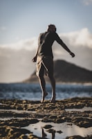 man standing near seashore