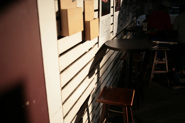 An inviting outdoor seating area bathed in golden afternoon light, perfect for a relaxed meal.