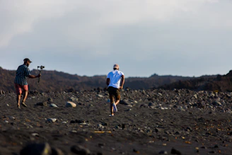 Runners navigating rugged Mongolian terrain under a vast sky during the Uukhai Adventure Race.