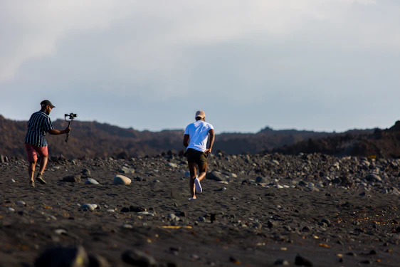 Runners navigating rugged Mongolian terrain under a vast sky during the Uukhai Adventure Race.