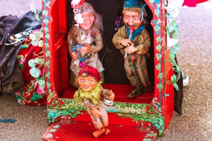 Humorous depiction of a debate stage with candidates as puppets.