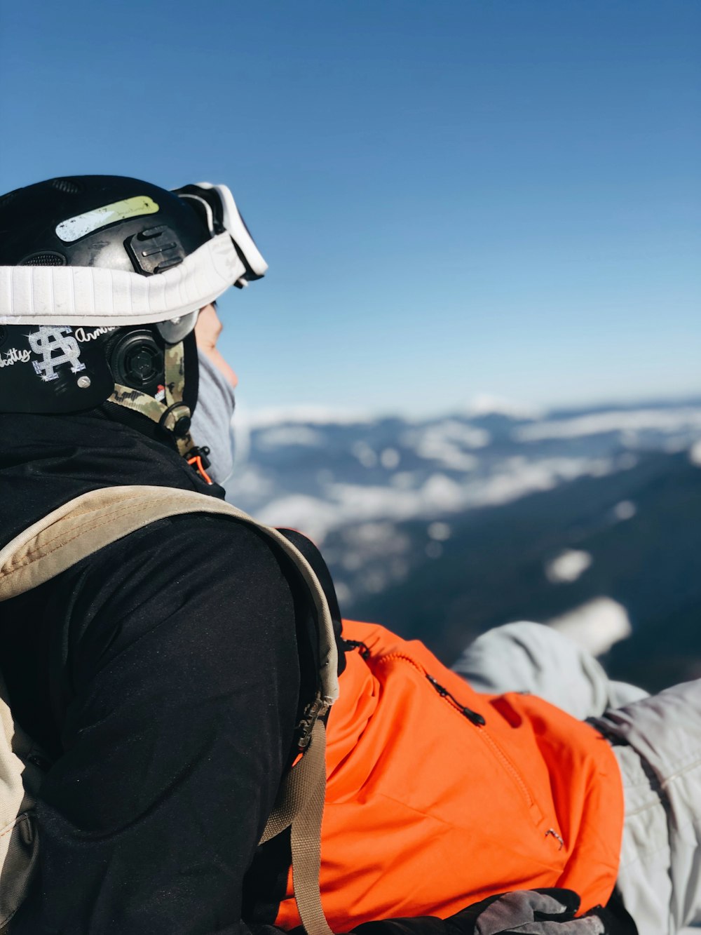 man sitting on mountain's top