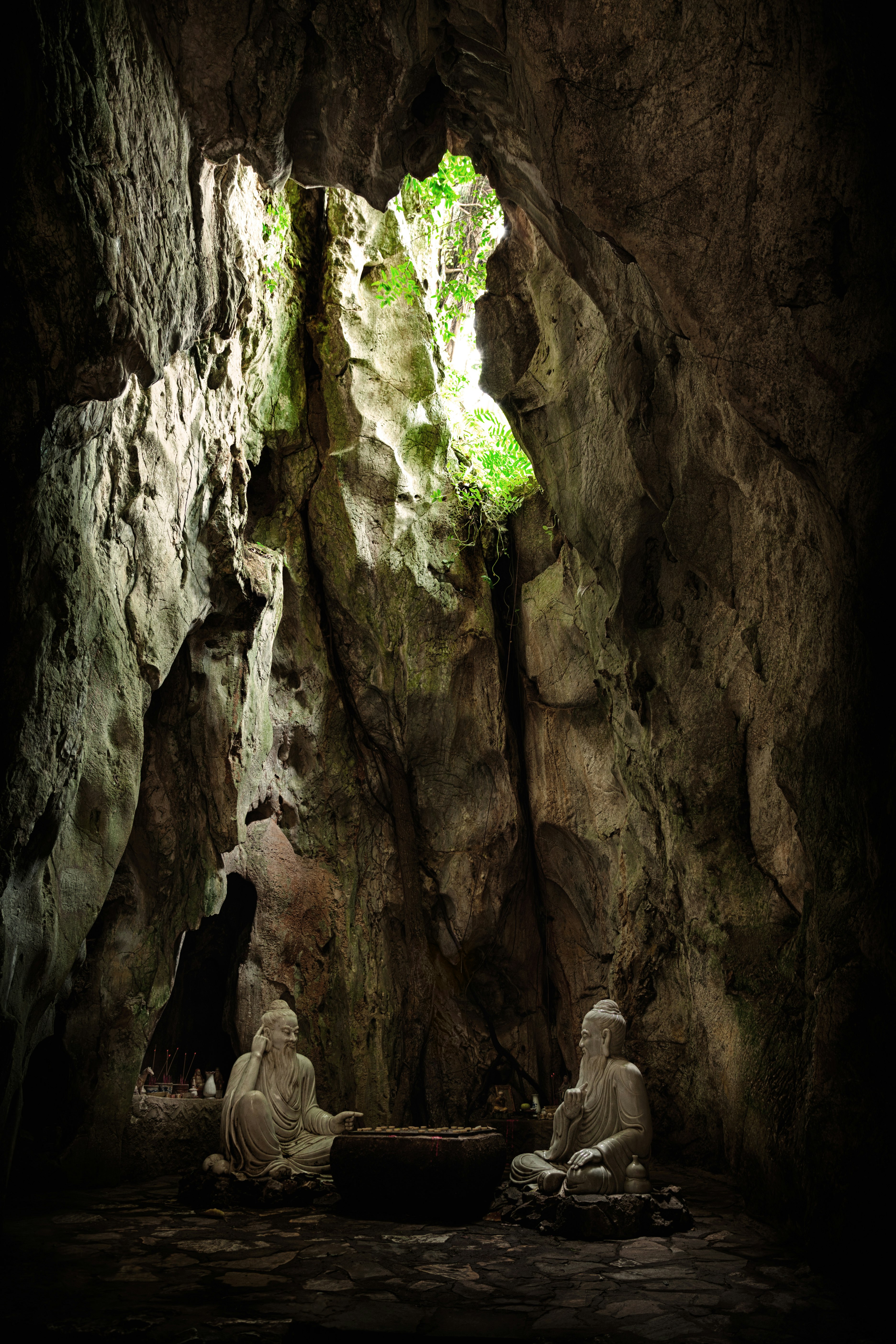 two statues in cave