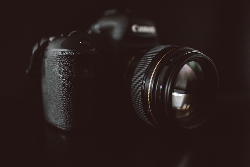 shallow focus photo of Canon DSLR camera