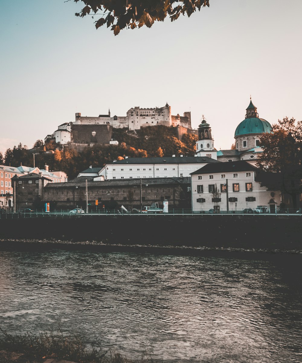 white buildings across body of water