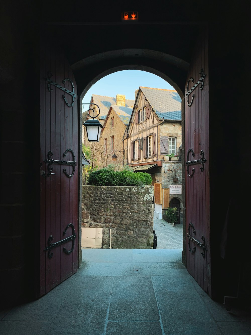 opened red wooden doors