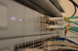 a bunch of wires are connected to a wall