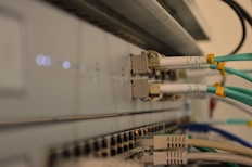 a bunch of wires are connected to a wall