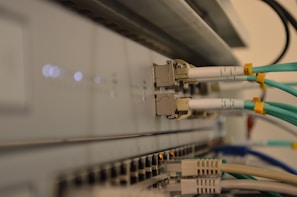 a bunch of wires are connected to a wall