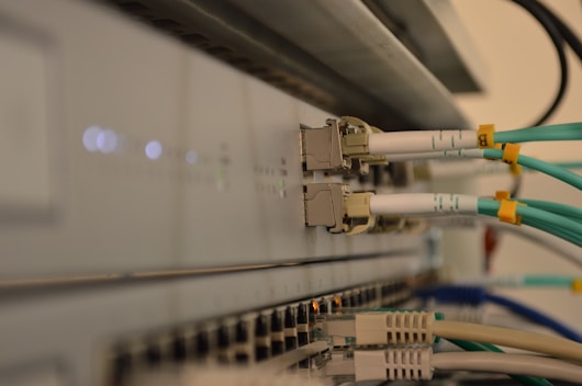a bunch of wires are connected to a wall