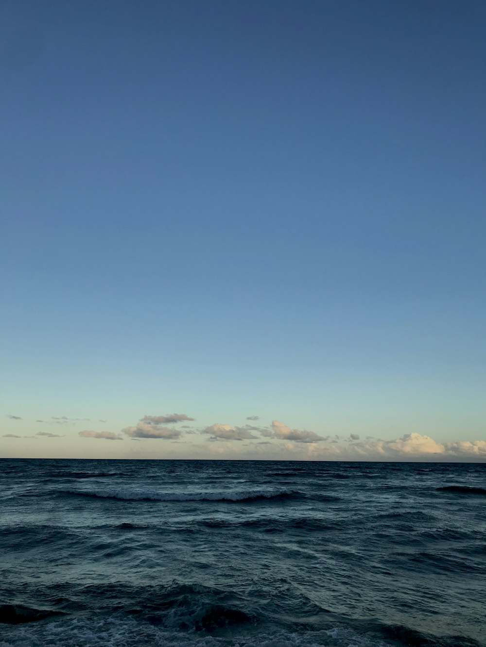 beach under blue sky during daytime