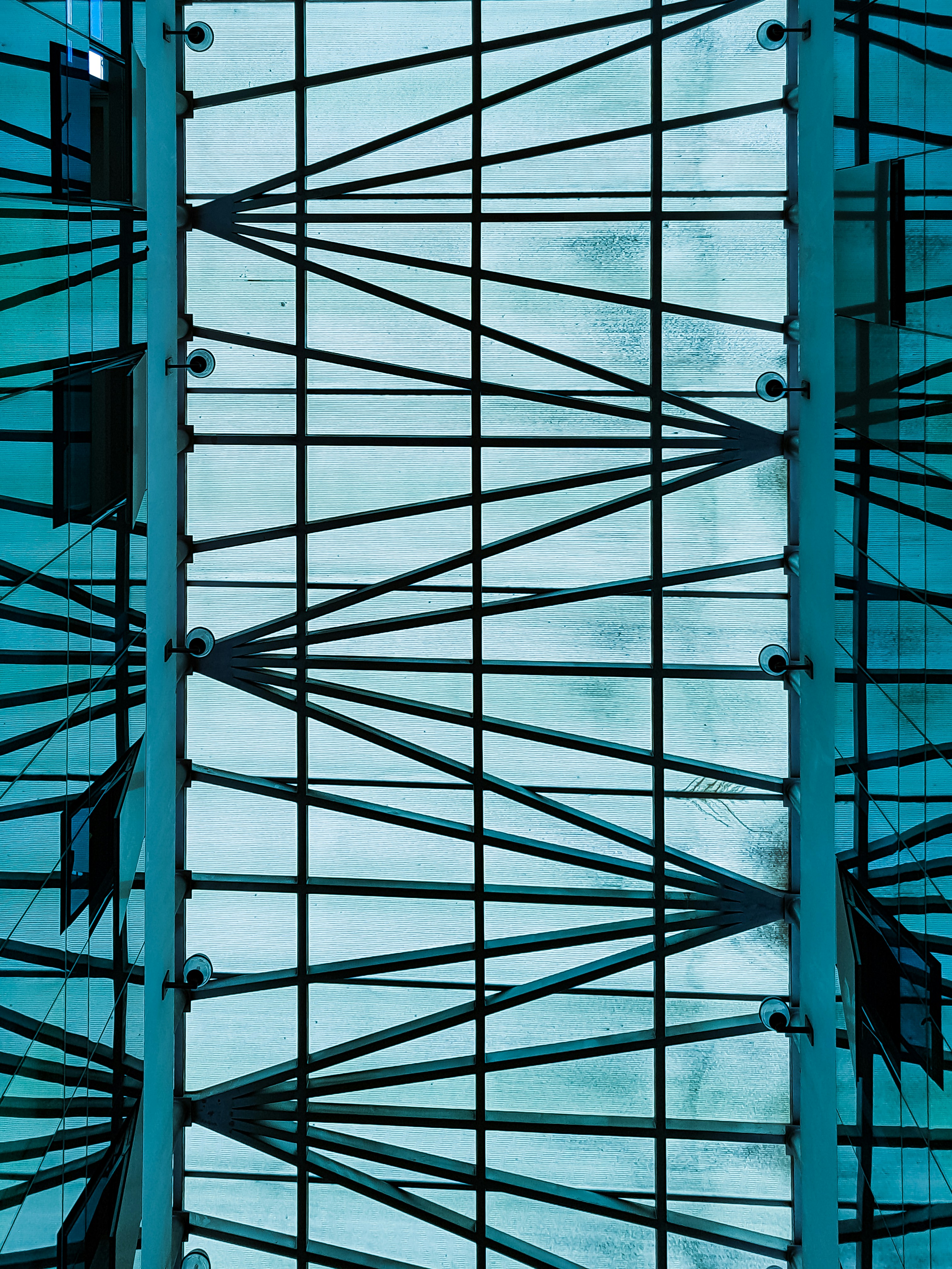 a view of the ceiling of a building from below