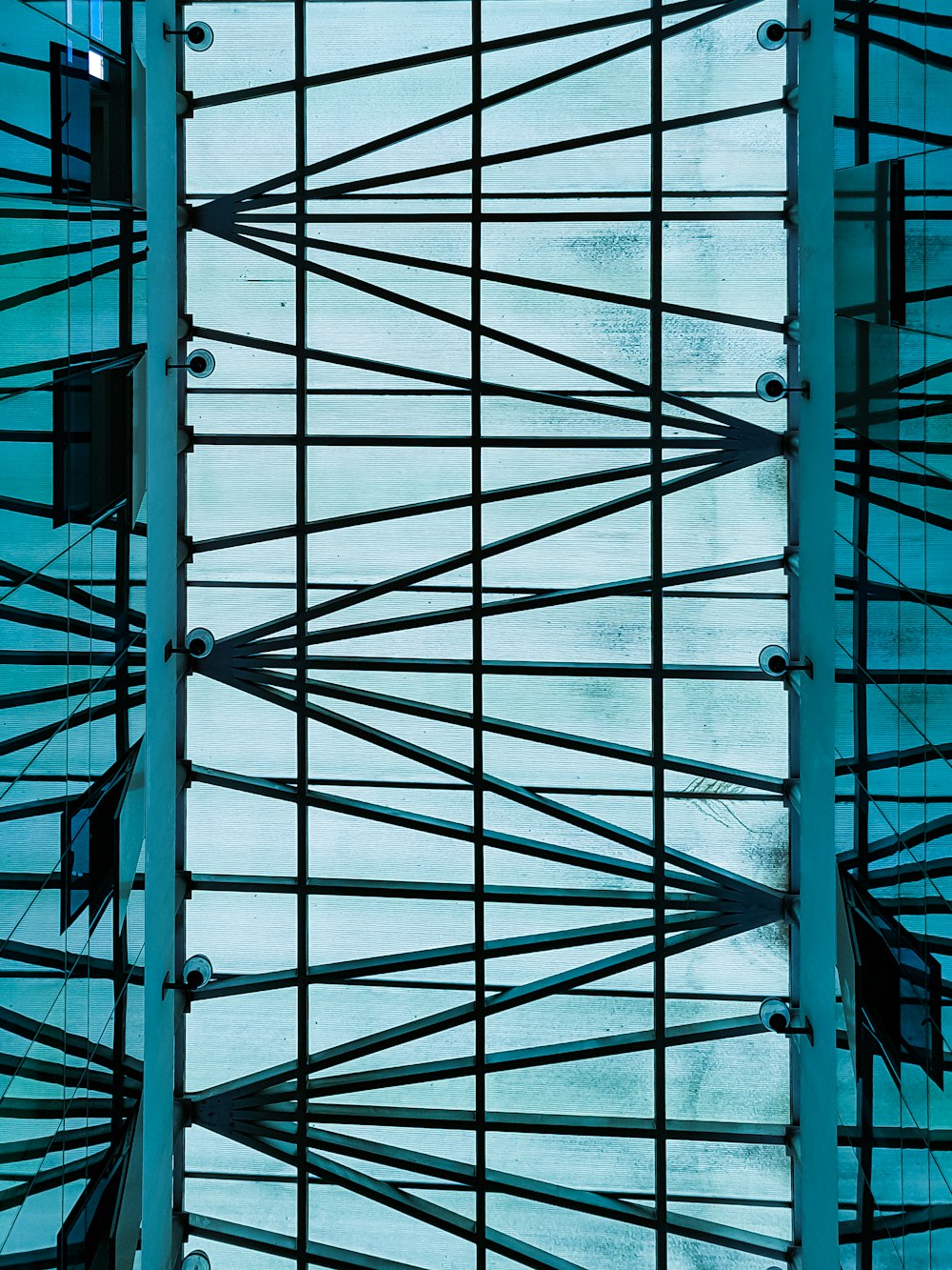 a view of the ceiling of a building from below