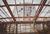Engineers inspecting a high-performance greenhouse structure with safety features.