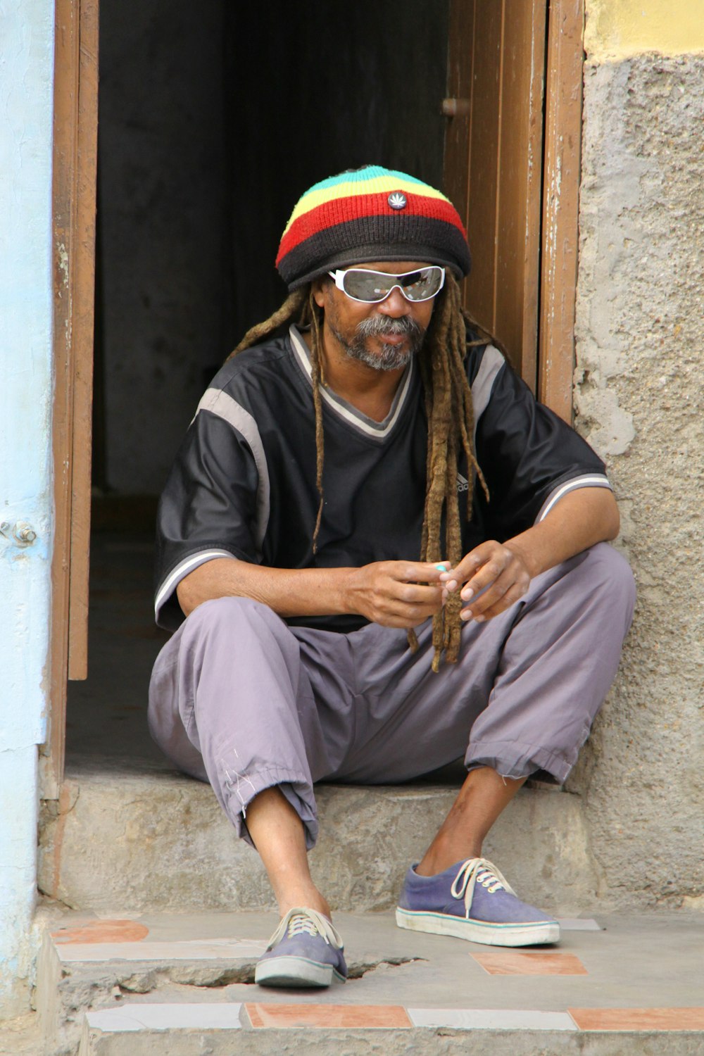 man sitting on door surface