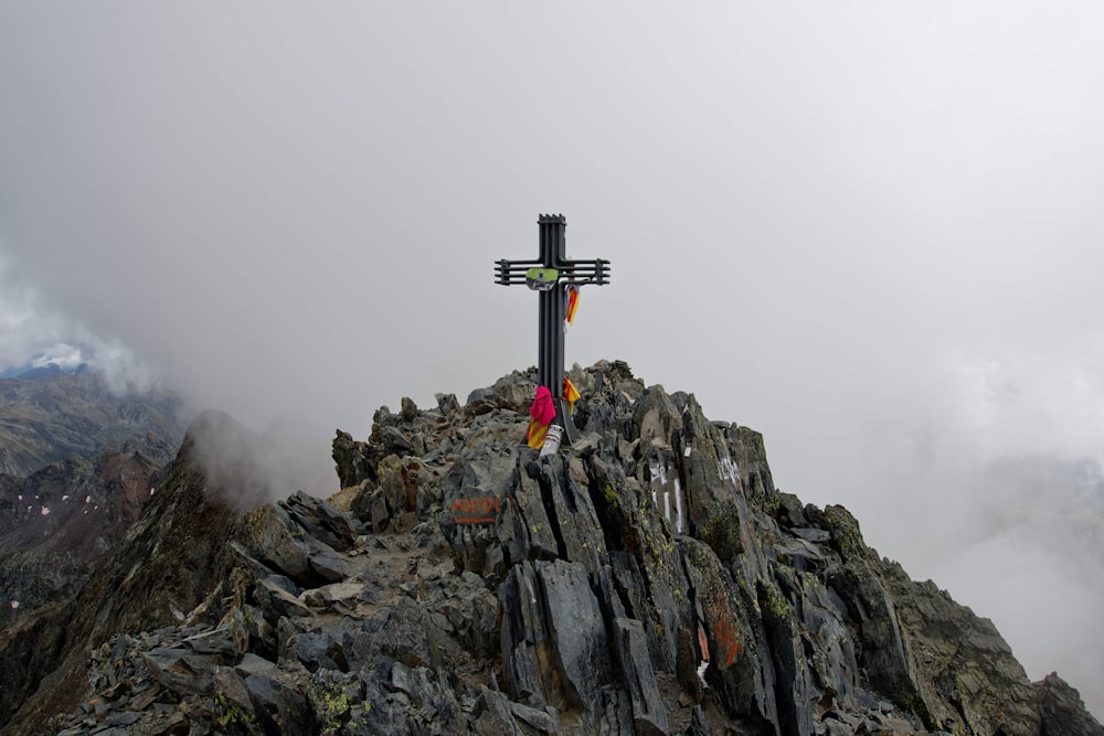 giant cross on rock mountain top