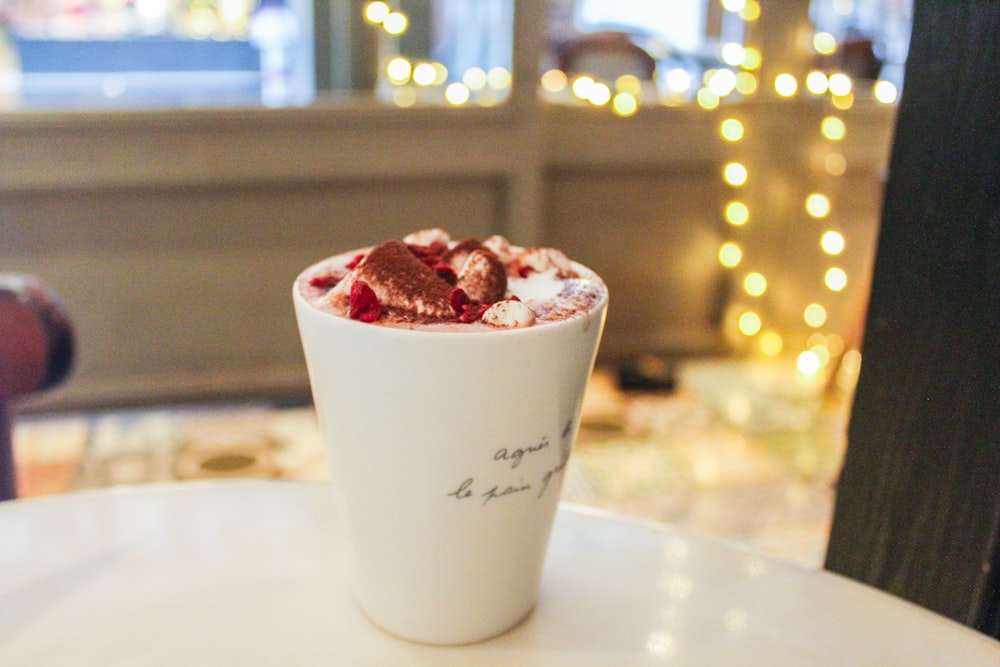 white cup on table