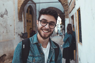 smiling man standing near building