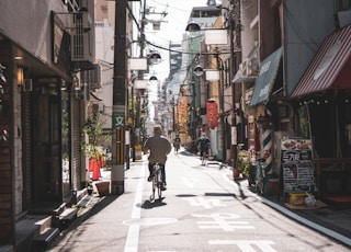 person biking on road during daytime