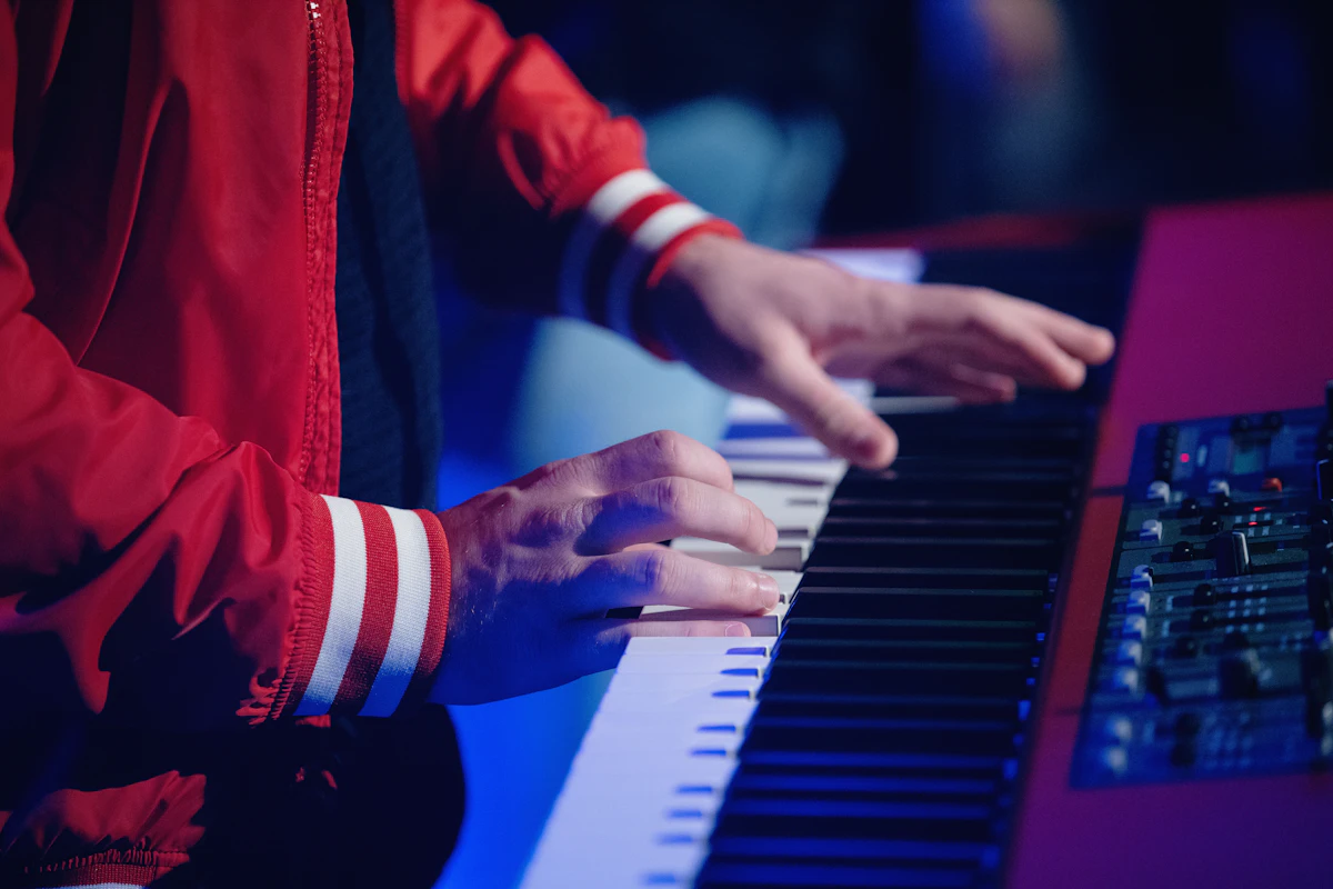 Musician playing a keyboard with both hands