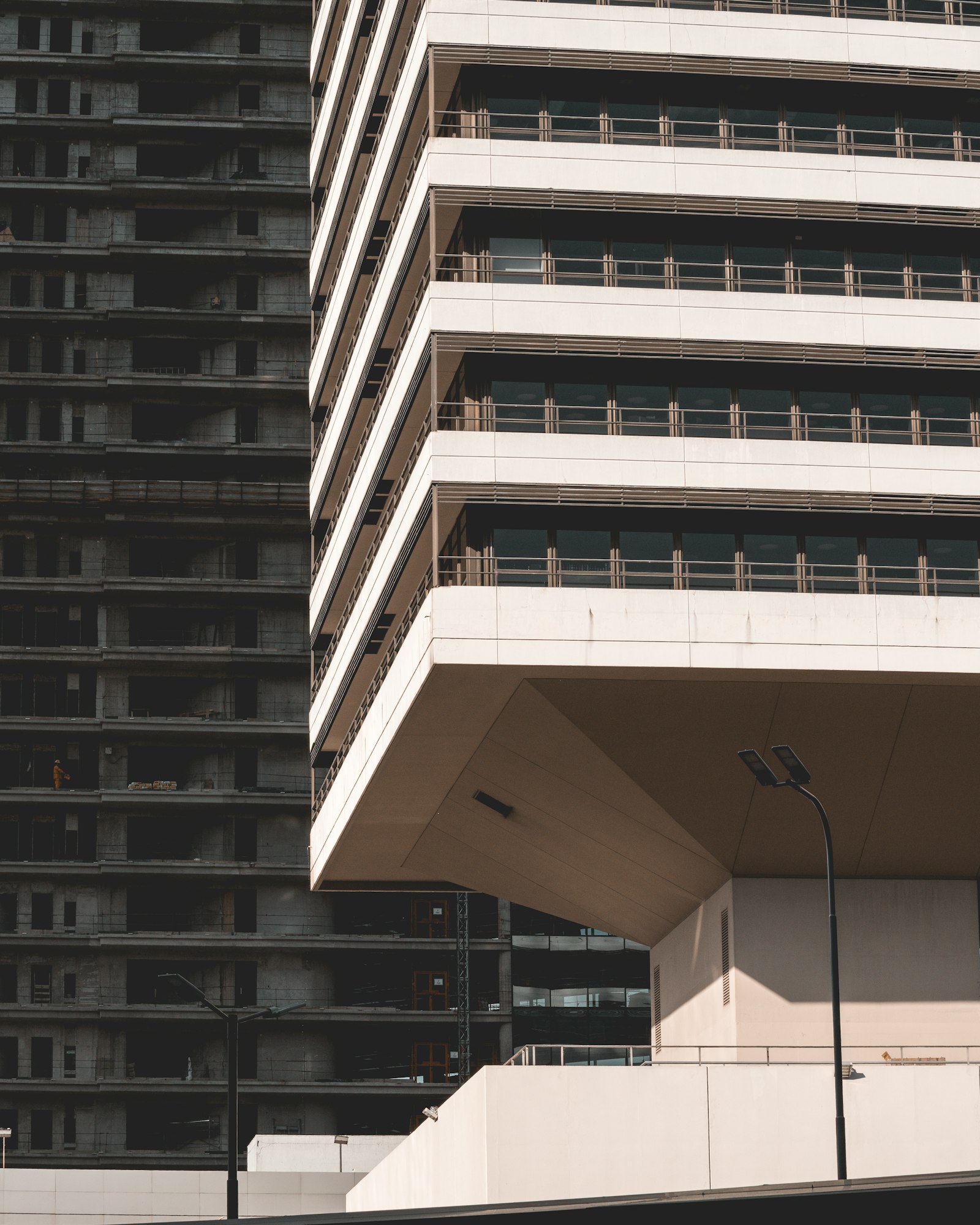 Nikon D5300 + Nikon AF-S DX Nikkor 55-200mm F4-5.6G VR II sample photo. White concrete high-rise building photography