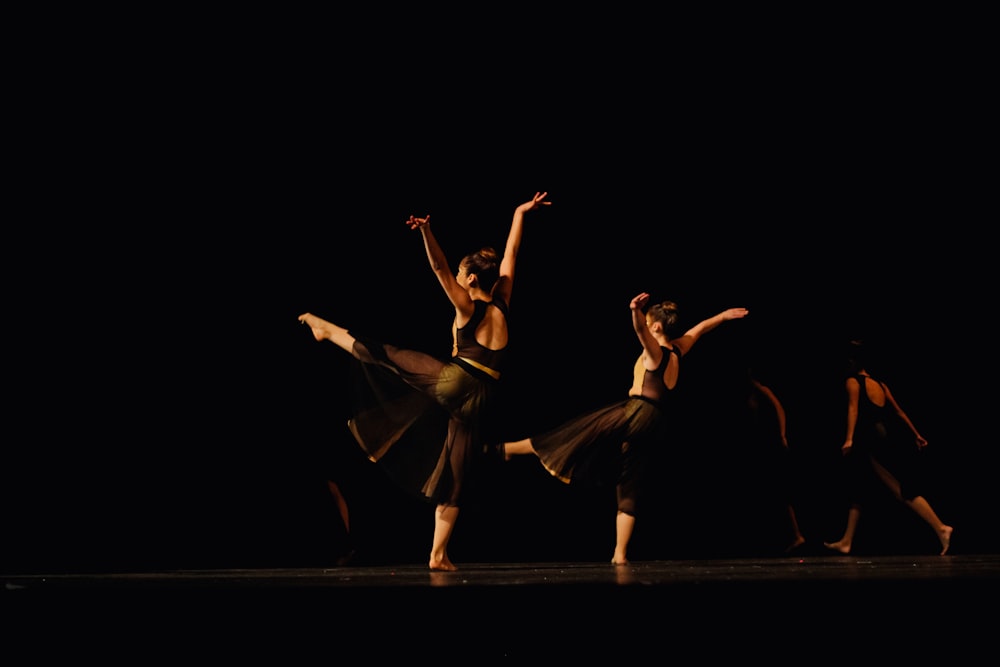 two woman dancing on the stage