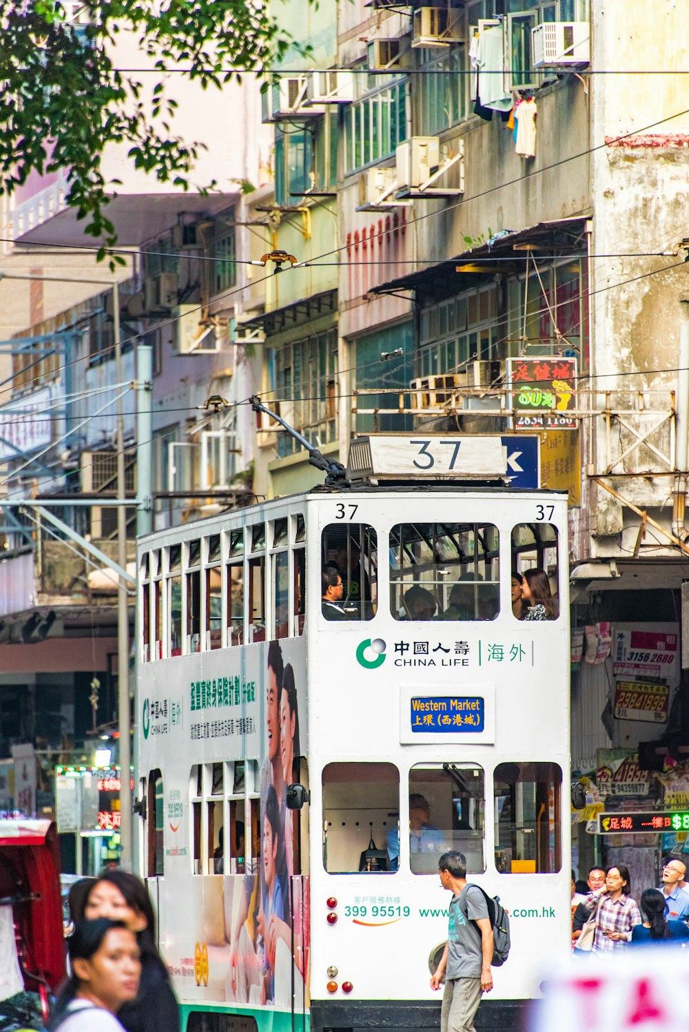 white transit bus on road