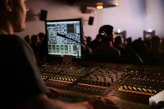 man in front of mixing console