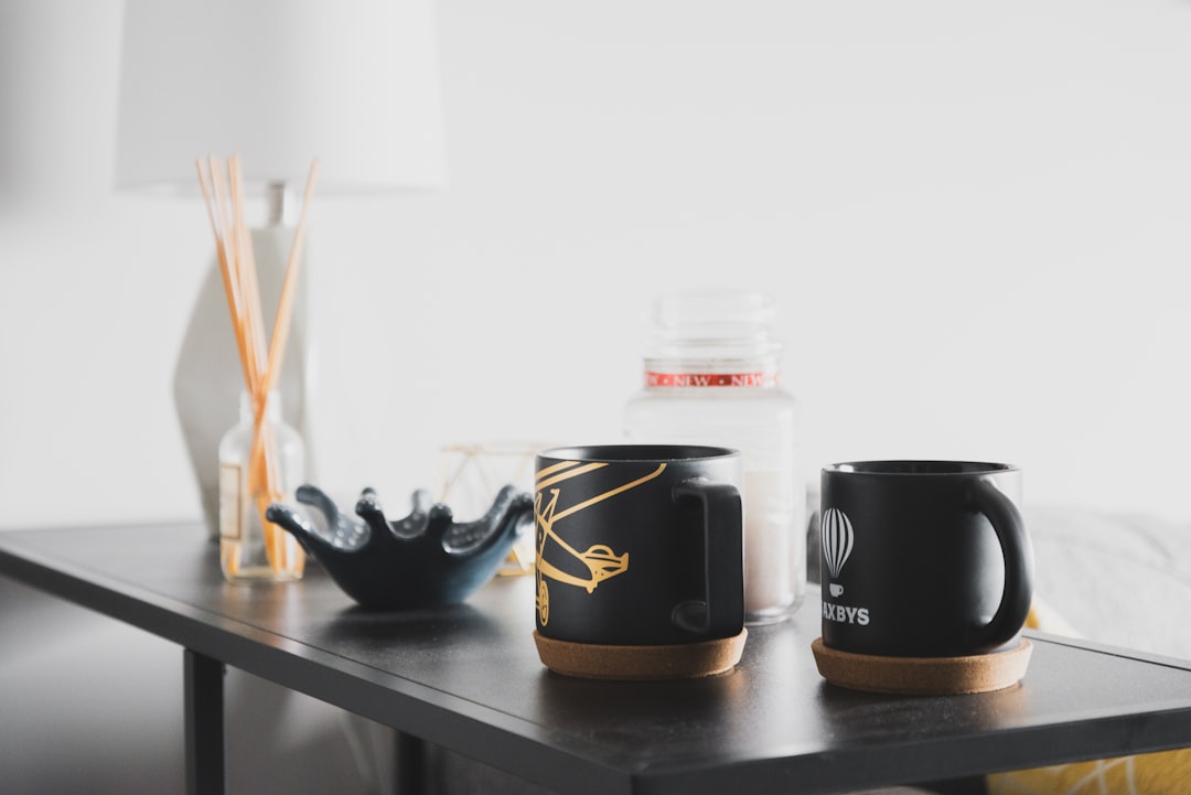 two black ceramic cups