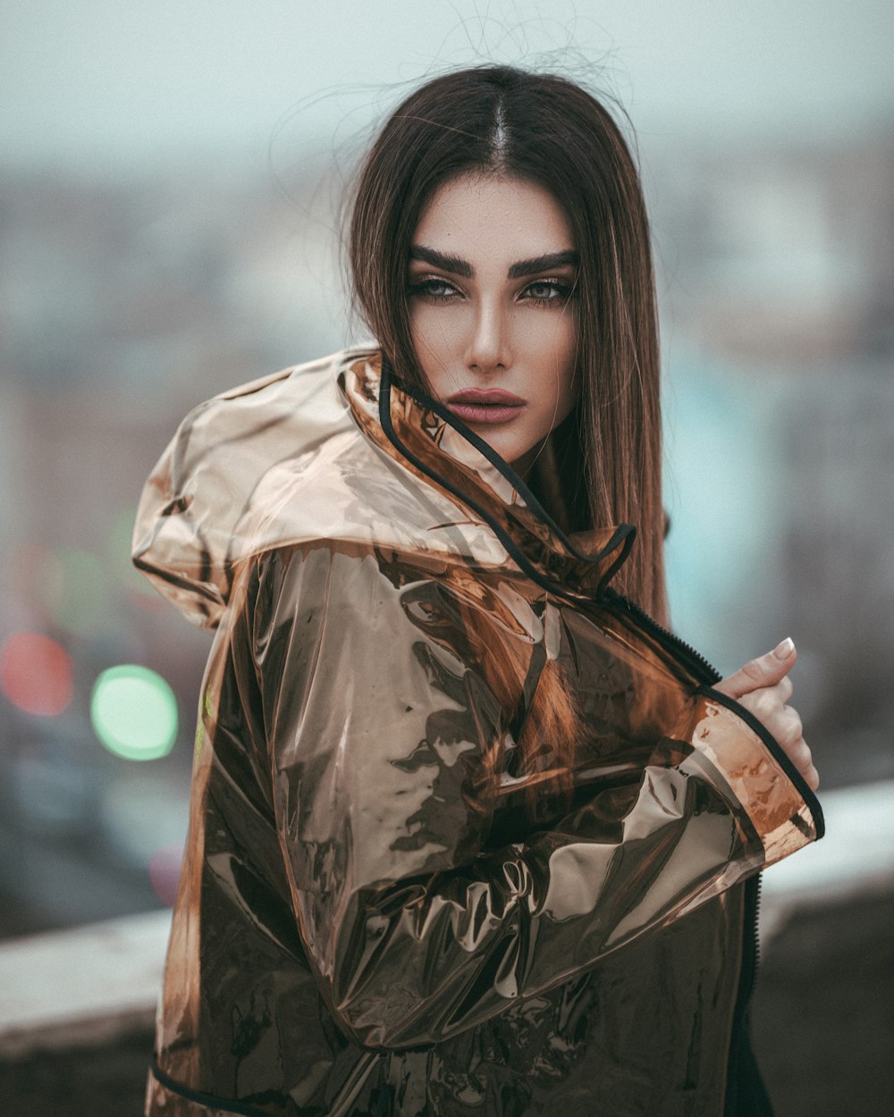 woman in gold zip-up hoodie in selective focus photography