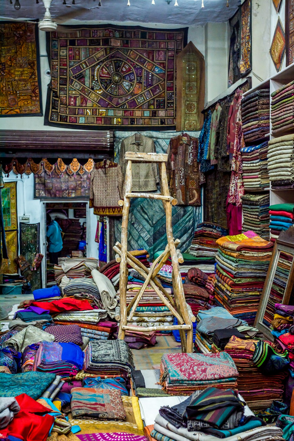 assorted-color clothes on shelf