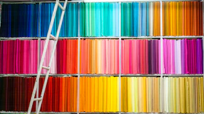 Close-up of colorful warehouse roll labels neatly arranged on a shelf