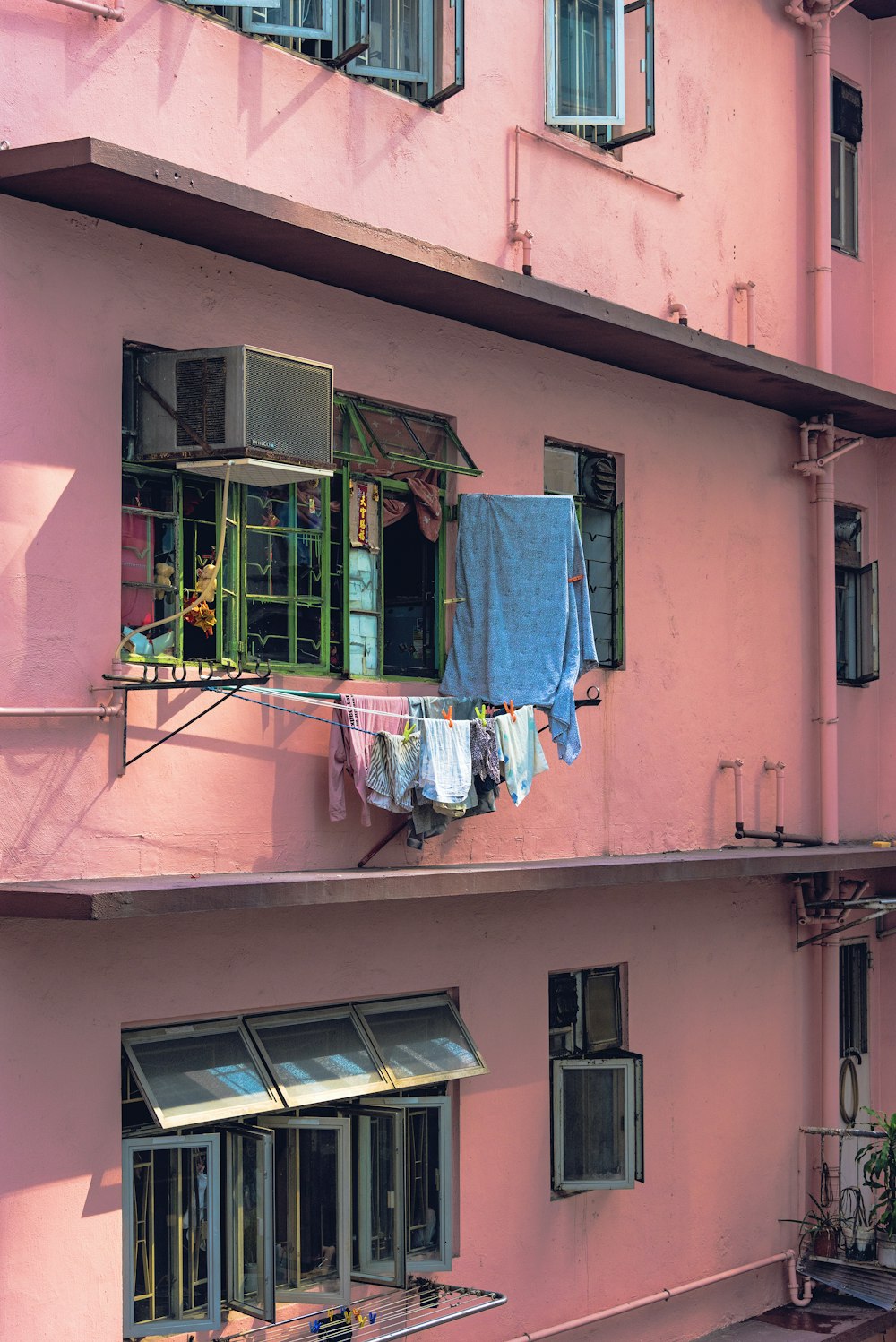 clothes hanged beside window