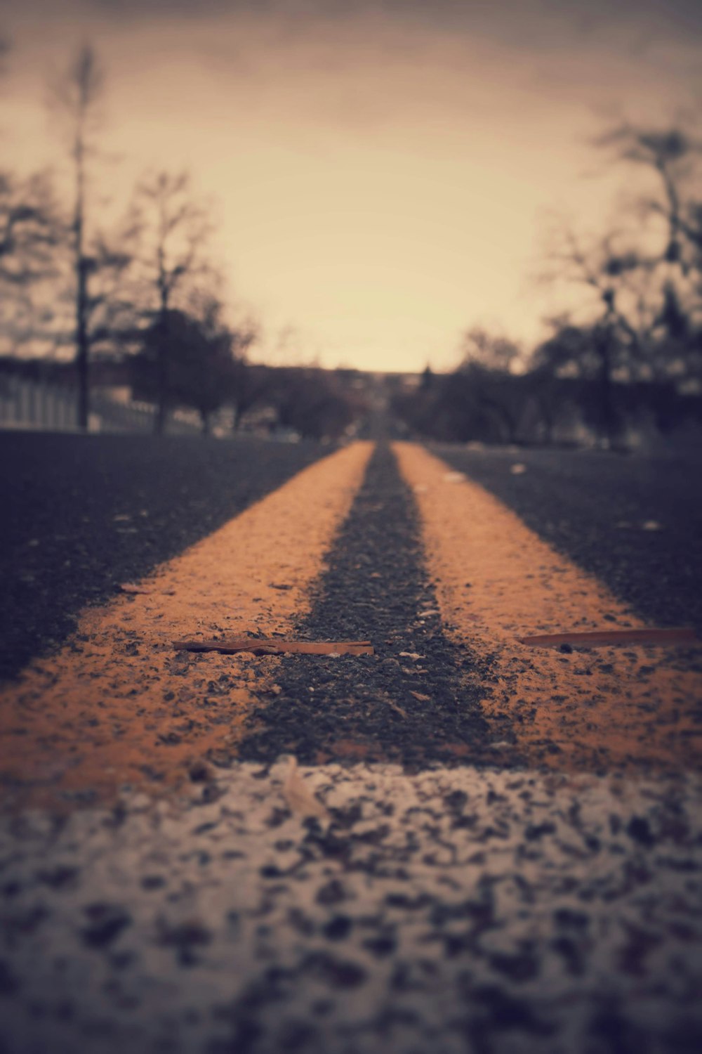 orange line on gray concrete pavement during daytime