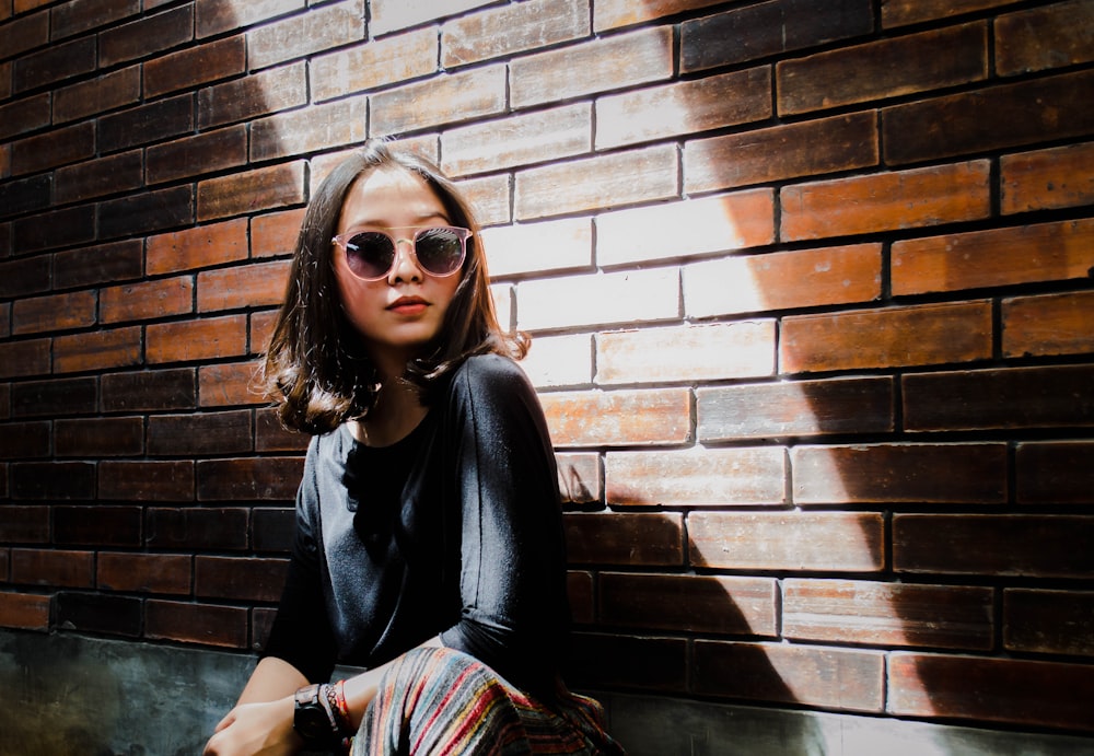 woman wearing black frame sunglasses