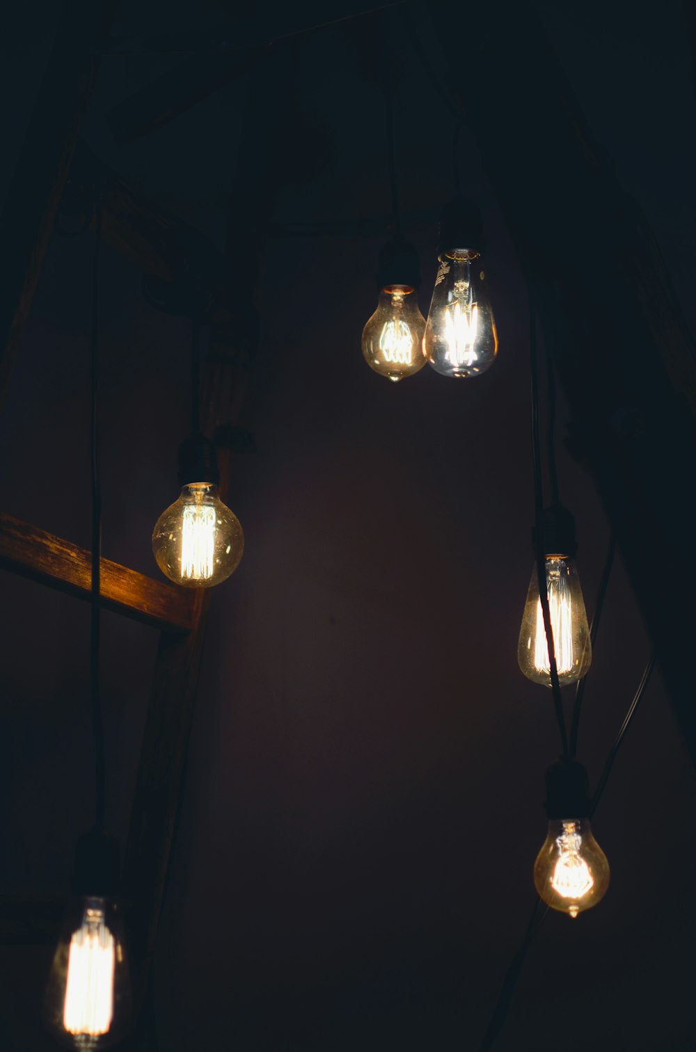 six clear light bulbs turned-on