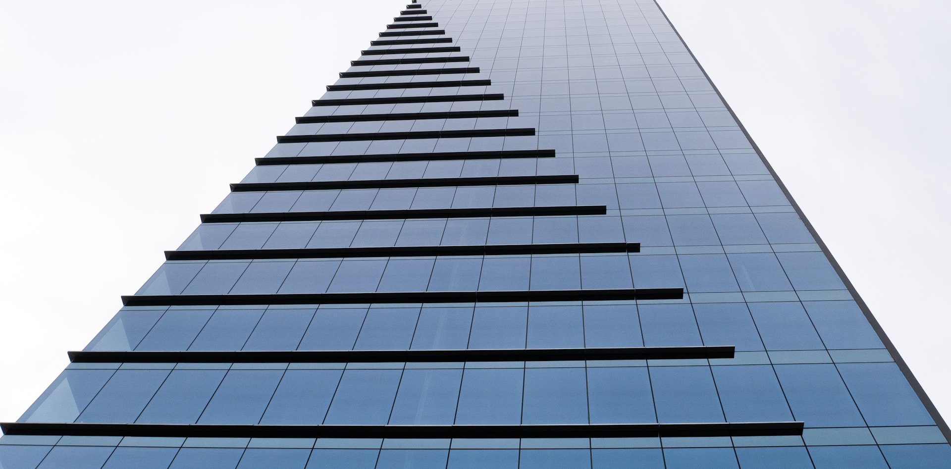 low-angle photography of glass high-rise building