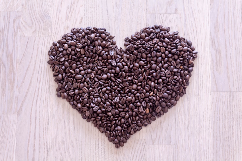 brown coffee beans forming heart