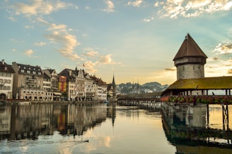 Chapel Bridge in Lucerne with lake and mountain background