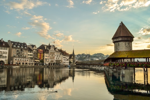 Chapel Bridge in Lucerne with lake and mountain background