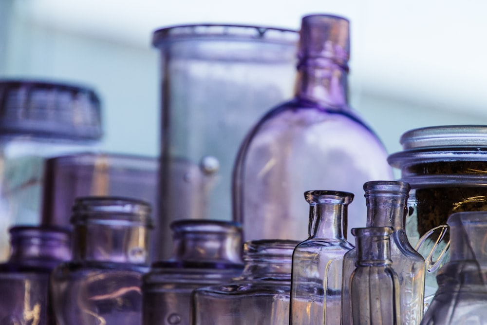 clear glass bottle lot in selective focus photography