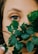 woman holding green-leafed plant