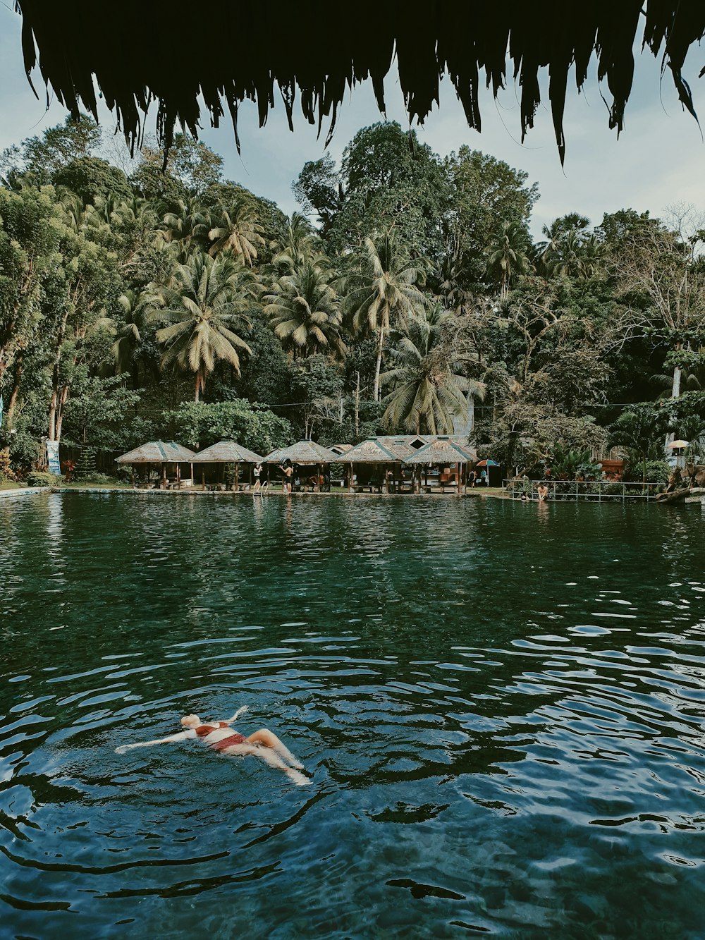 woman floating at the beach resort